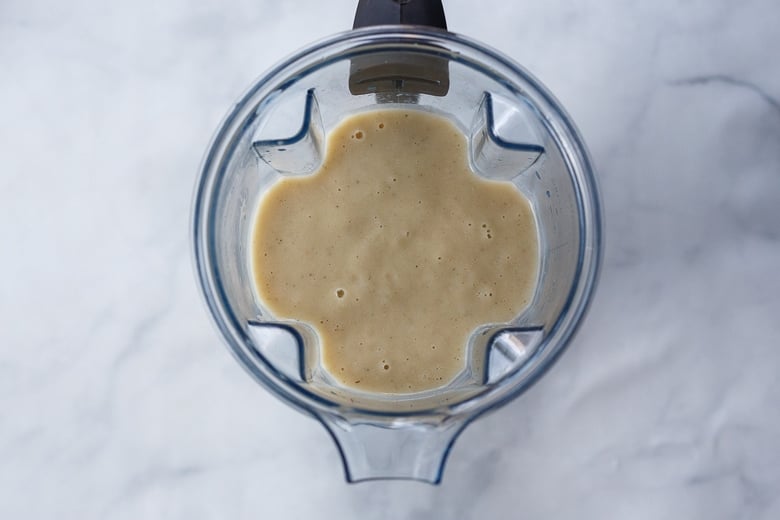 creamy cauliflower soup blended smooth in blender.