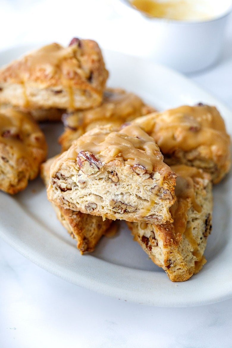 Golden Maple Pecan Scones are flakey,  buttery, and tender with a delicious nutty flavor from the toasty pecans and real maple syrup. A fun bake, perfect for special gatherings, and holiday mornings. 