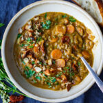 This vegan ecipe for Mediterranean Split Pea Soup is healthy and satisfying. Simple clean ingredients create a hearty soup that tastes even better the next day! Vegan and gluten-free.