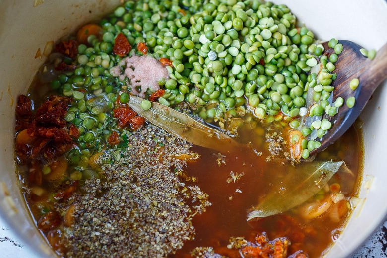 adding all ingredients into the pot to simmer
