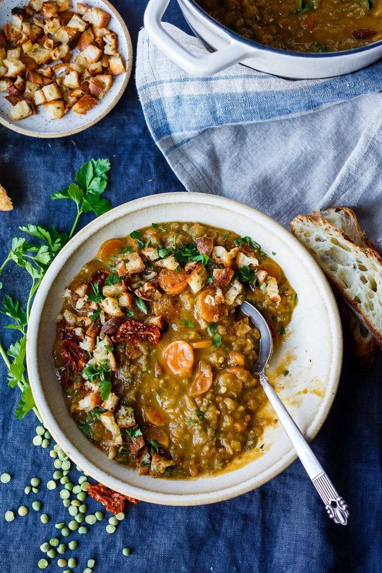 This vegan recipe for Mediterranean Split Pea Soup is healthy and satisfying.  Simple clean ingredients create a hearty soup that tastes even better the next day!  Vegan and gluten-free.