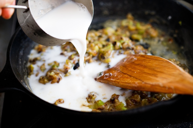 pouring in almond milk