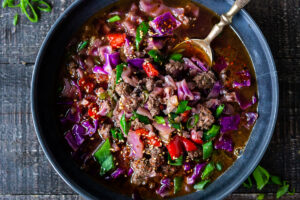 A fast and easy recipe recipe for Hot and Sour Cabbage Soup with ginger, scallions and your choice of ground meat (or sub plant-based ground meat). Vegan-Adaptable.  