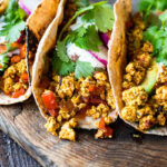 Vegan Breakfast Tacos with Mexican scrambled tofu, avocado, cilantro and pico de gayo.