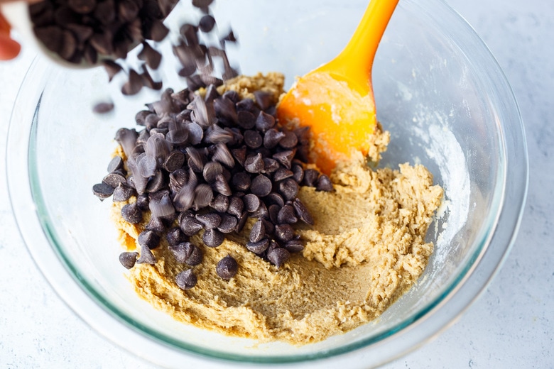 mixing chocolate chips into dough