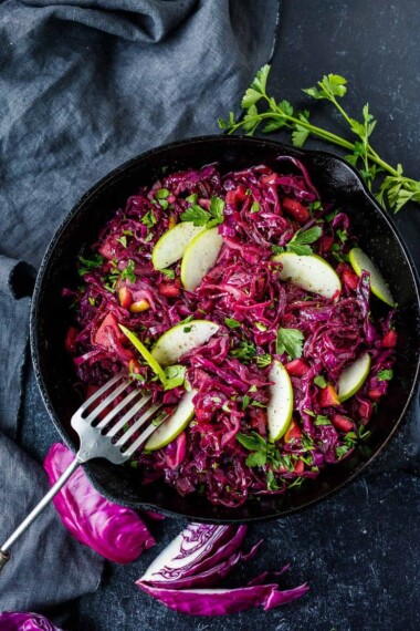 Warm Red Cabbage Slaw with tart apples is a delicious winter side dish with a lovely sweet and sour balance.  A  healthy complement to rich holiday dishes.  Simple to make.  Vegan and gluten-free.