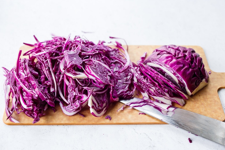 shredding cabbage for sauteed cabbage.