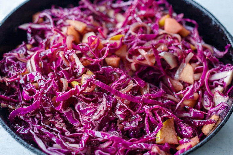 cabbage sauteed in a skillet. 