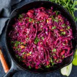 Warm Red Cabbage Slaw with tart apples is a delicious winter side dish with a lovely sweet and sour balance. A healthy complement to rich holiday dishes. Simple to make. Vegan and gluten-free.