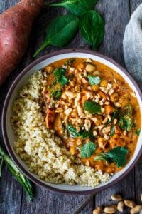 Spicy African Peanut Soup is made with everyday pantry items that transform into a lively soup with full bodied flavors. Richly spiced with ginger, garlic, and chilies in a creamy peanut tomato base, this protein-rich soup is one you will crave. Vegan and Gluten-free!