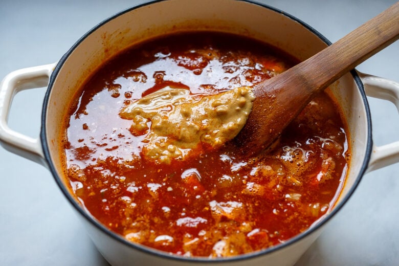 Yams, chickpeas, tomato paste, diced tomatoes, broth or stock, peanut butter, salt, and red pepper flakes in African Peanut Soup.