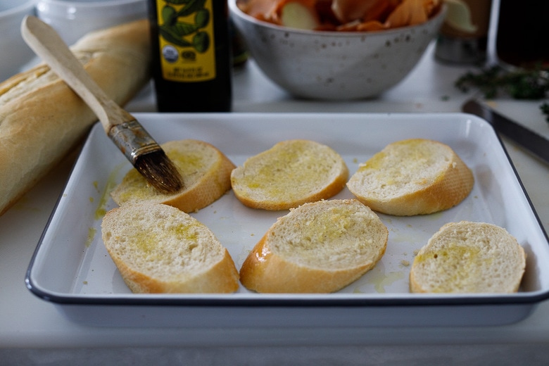 slice and toast the baguettes with olive oil.