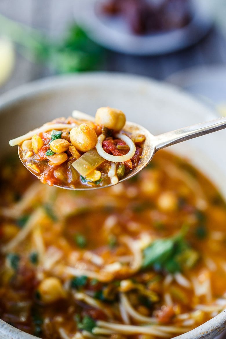 Moroccan Lentil and Chickpea Soup (aka Harira) is hearty, full of protein and loaded with nutrients.  Warming fragrant spices make this healthy one-pot meal deeply flavorful!  Vegan and Gluten-Free adaptable.