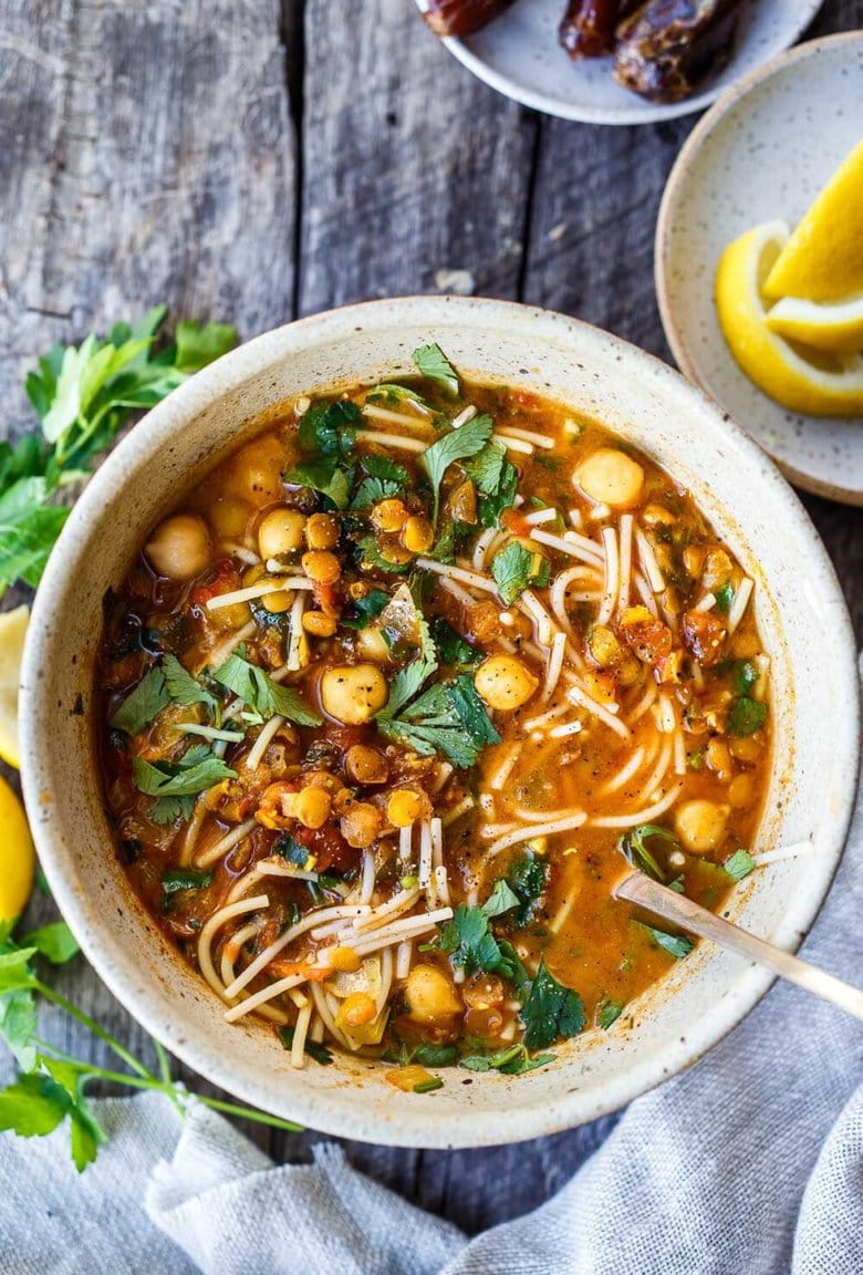 Moroccan Lentil and Chickpea Soup (aka Harira) is hearty, full of protein and loaded with nutrients.  Warming fragrant spices make this healthy one-pot meal deeply flavorful!  Vegan and Gluten-Free adaptable.