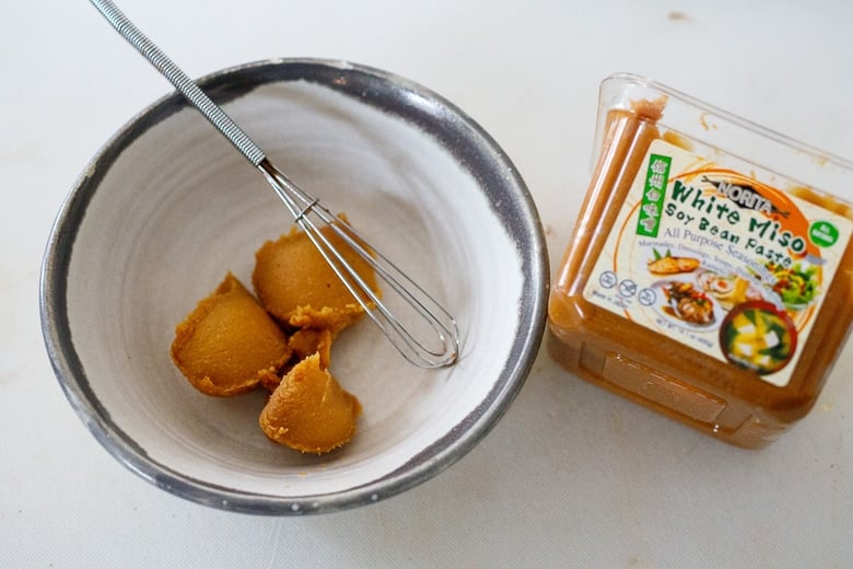 place miso paste in a bowl