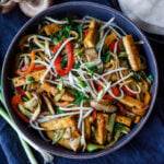 This Moo Shu Tofu recipe is loaded with tender-crisp vegetables and crispy tofu tucked into a tortilla or rice pancake, slathered with a tangy hoisin sauce.  A quick and easy weeknight dinner!  Vegan and Gluten-Free.