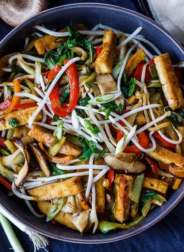 This Moo Shu Tofu recipe is loaded with tender-crisp vegetables and crispy tofu tucked into a tortilla or rice pancake, slathered with a tangy hoisin sauce.  A quick and easy weeknight dinner!  Vegan and Gluten-Free.