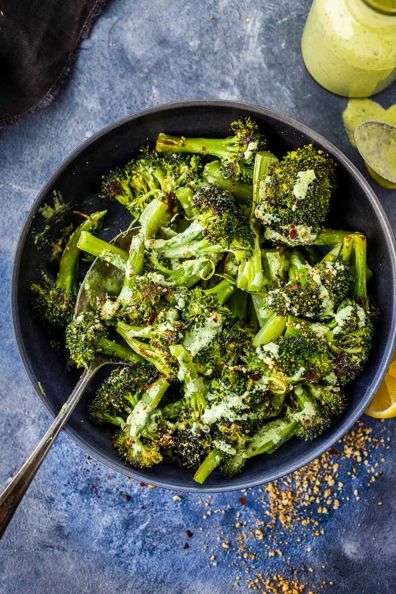 How to make Crispy Oven Roasted Broccoli - perfect as a simple side dish or use to enhance other dishes.  Baking in a hot oven yields tender-crisp broccoli in under 30 minutes. Fast and EASY Recipe!