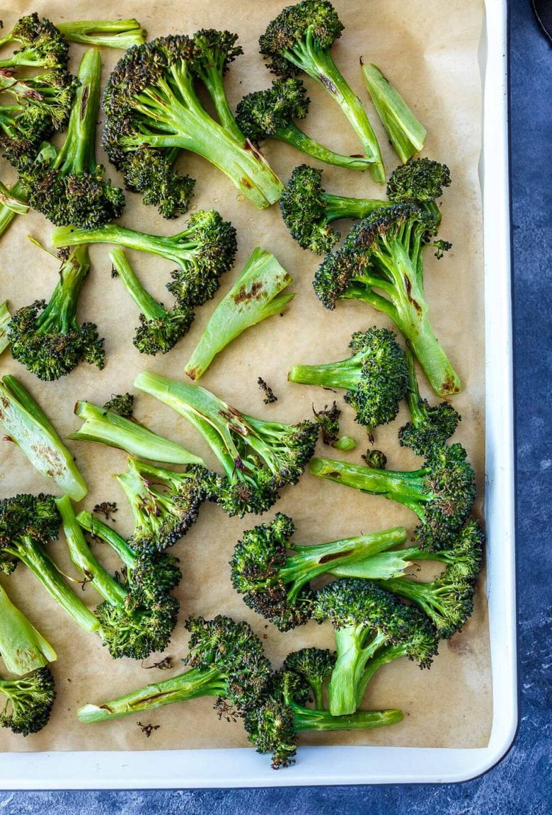 How to make Crispy Oven Roasted Broccoli - perfect as a simple side dish or use to enhance other dishes. Baking in a hot oven yields tender-crisp broccoli in under 30 minutes. Fast and EASY Recipe!
