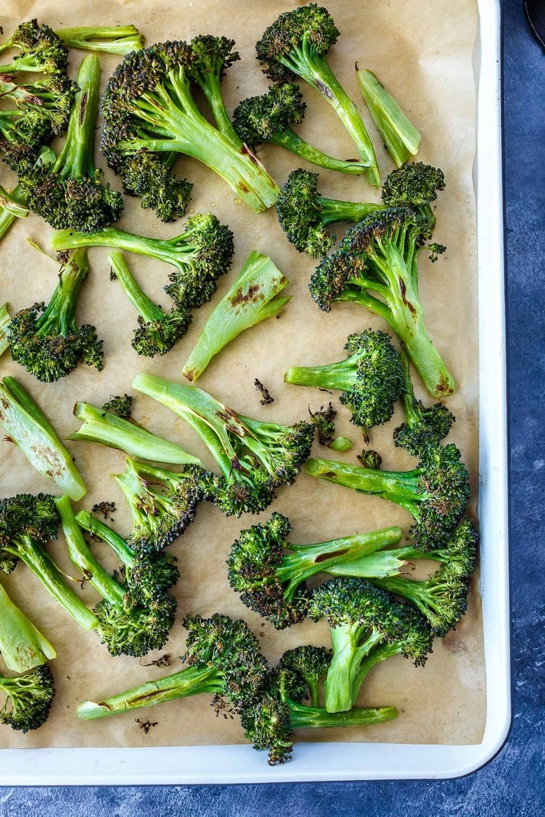 How to make Crispy Oven Roasted Broccoli - perfect as a simple side dish or use to enhance other dishes.  Baking in a hot oven yields tender-crisp broccoli in under 30 minutes. Fast and EASY Recipe!
