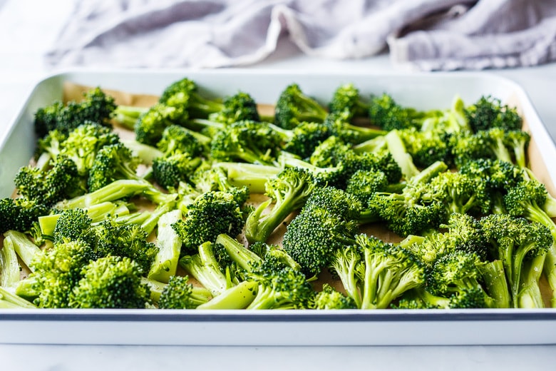 lay broccoli on a rimmed sheet pan with parchment