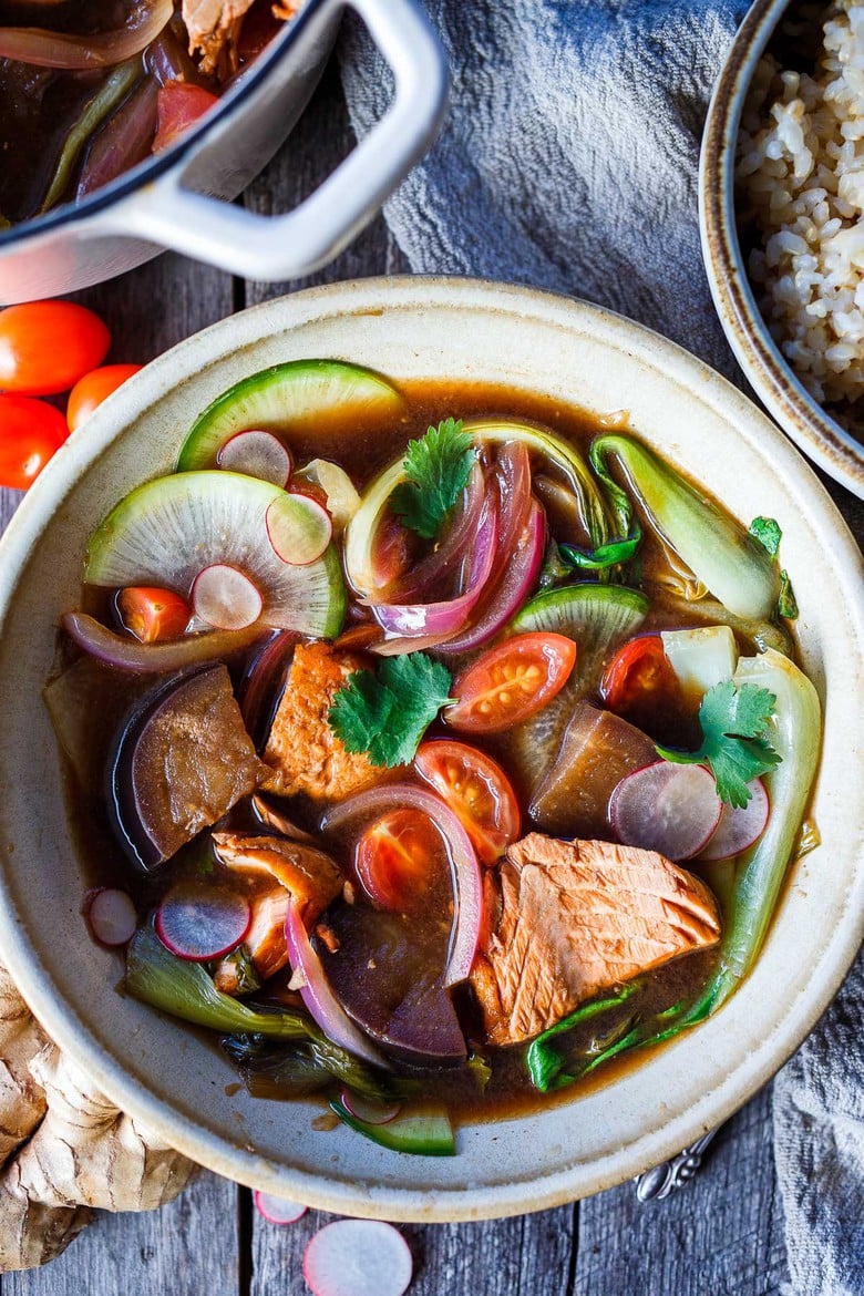 Sinigang! Filipino Sour Soup with Salmon is bursting with umami flavor.  Quick to throw together, loaded with veggies and completely delicious.  Serve with rice if desired.  Vegan-adaptable and gluten free.