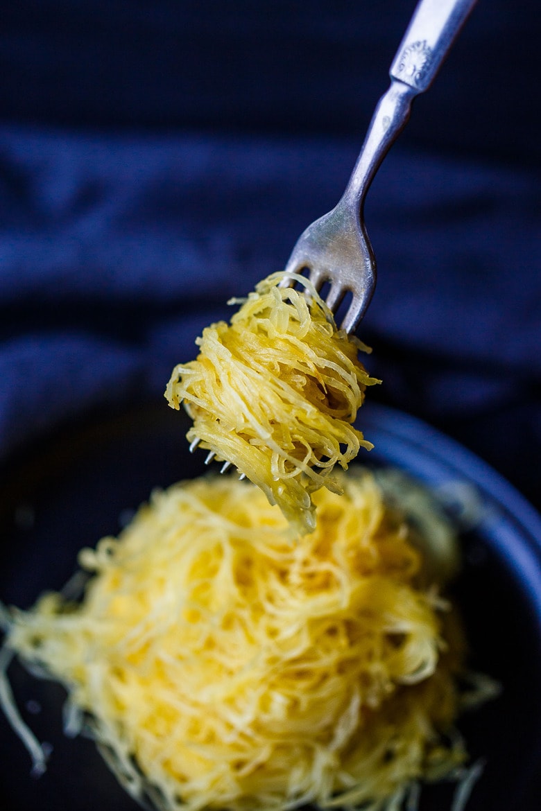 Learn How to Cook Spaghetti Squash -a faster method for roasted Spaghetti Squash that yields long spaghetti-like strands with better texture.