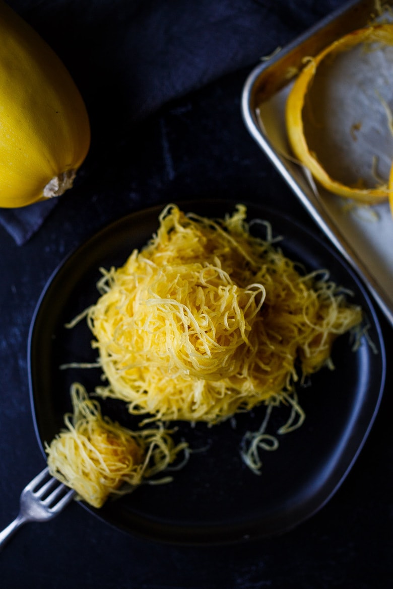 Learn How to Cook Spaghetti Squash -a faster method for roasted Spaghetti Squash that yields long spaghetti-like strands with better texture.