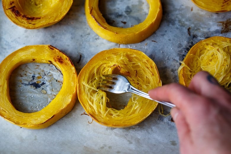 separating strands from the roasted spaghetti squash 
