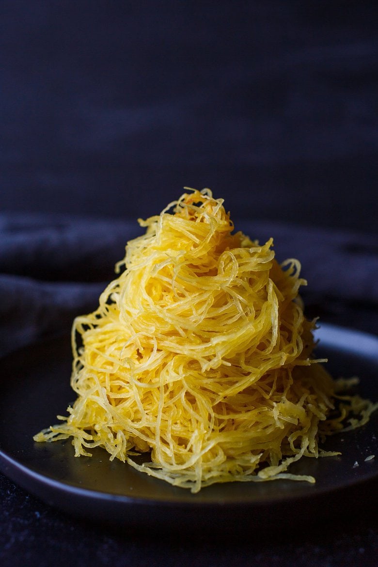 Learn How to Cook Spaghetti Squash -a faster method for roasted Spaghetti Squash that yields long spaghetti-like strands with better texture.