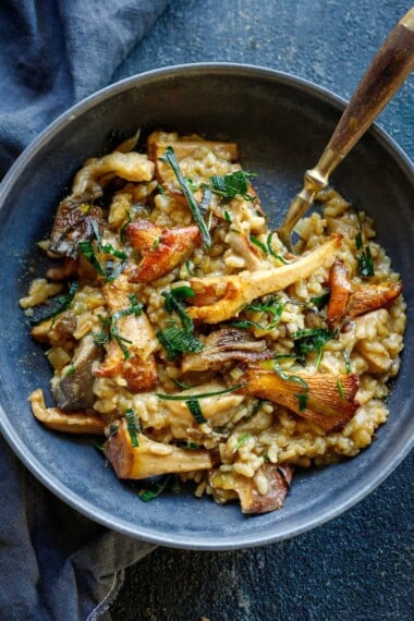 Simple authentic Mushroom Risotto with rosemary, garlic and frizzled leeks- a satisfying, elegant vegetarian dinner, perfect for special occasions, date night or entertaining. 