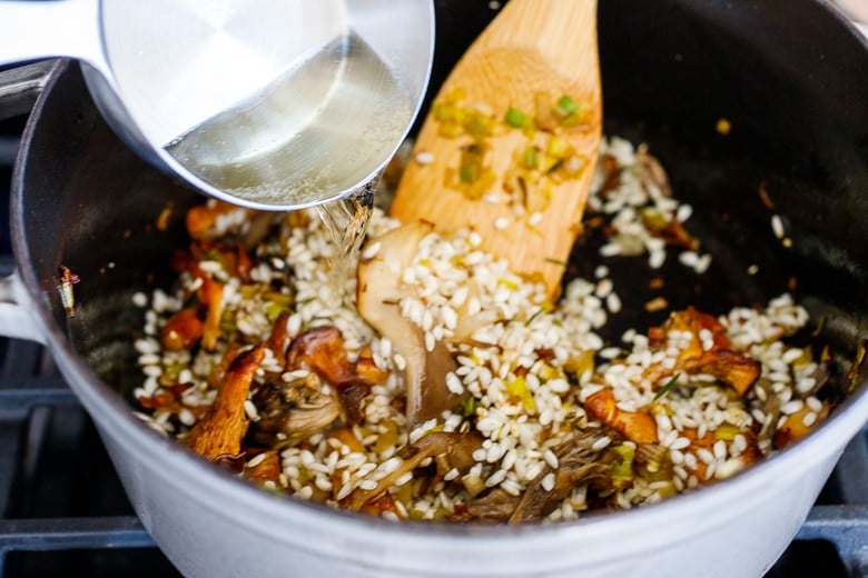 adding ½ cup white wine to the risotto