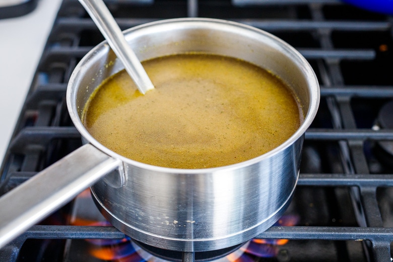 heat broth in a saucepan 