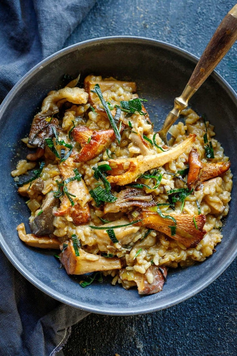 How to make authentic Mushroom Risotto with rosemary, garlic and frizzled leeks- a satisfying, elegant vegetarian dinner, perfect for special occasions, date night or entertaining. 