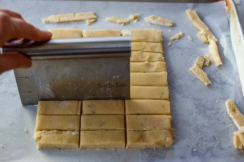 cutting the shortbread into finger shapes.