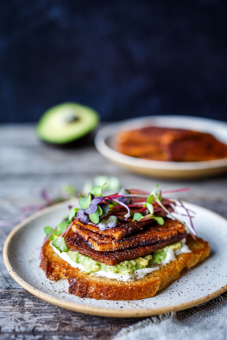 This smoky, crispy Vegan Bacon is made with tofu and is perfectly chewy and savory.  A delicious plant-based protein, perfect for breakfast, BLTs, wraps, sandwiches, pastas, and buddha bowls.