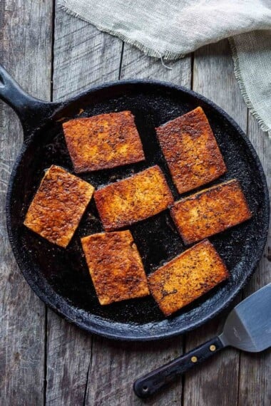 This smoky, crispy Vegan Bacon is made with tofu and is perfectly chewy and savory.  A delicious plant-based protein, perfect for breakfast, BLTs, wraps, sandwiches, pastas, and buddha bowls. #veganbacon