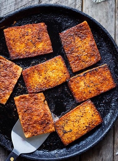 This smoky, crispy Vegan Bacon is made with tofu and is perfectly chewy and savory.  A delicious plant-based protein, perfect for breakfast, BLTs, wraps, sandwiches, pastas, and buddha bowls.