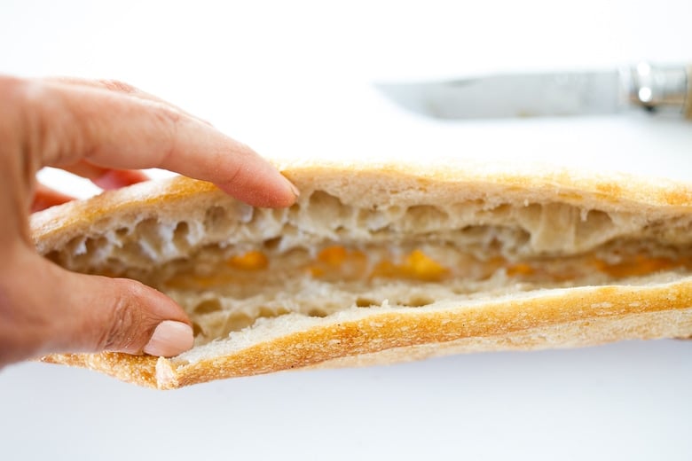 assembling the banh mi, cutting the bread