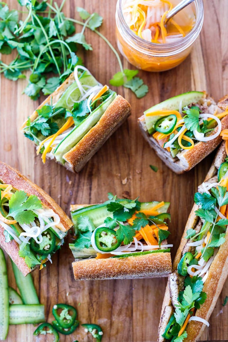 cutting the banh mi into pieces 