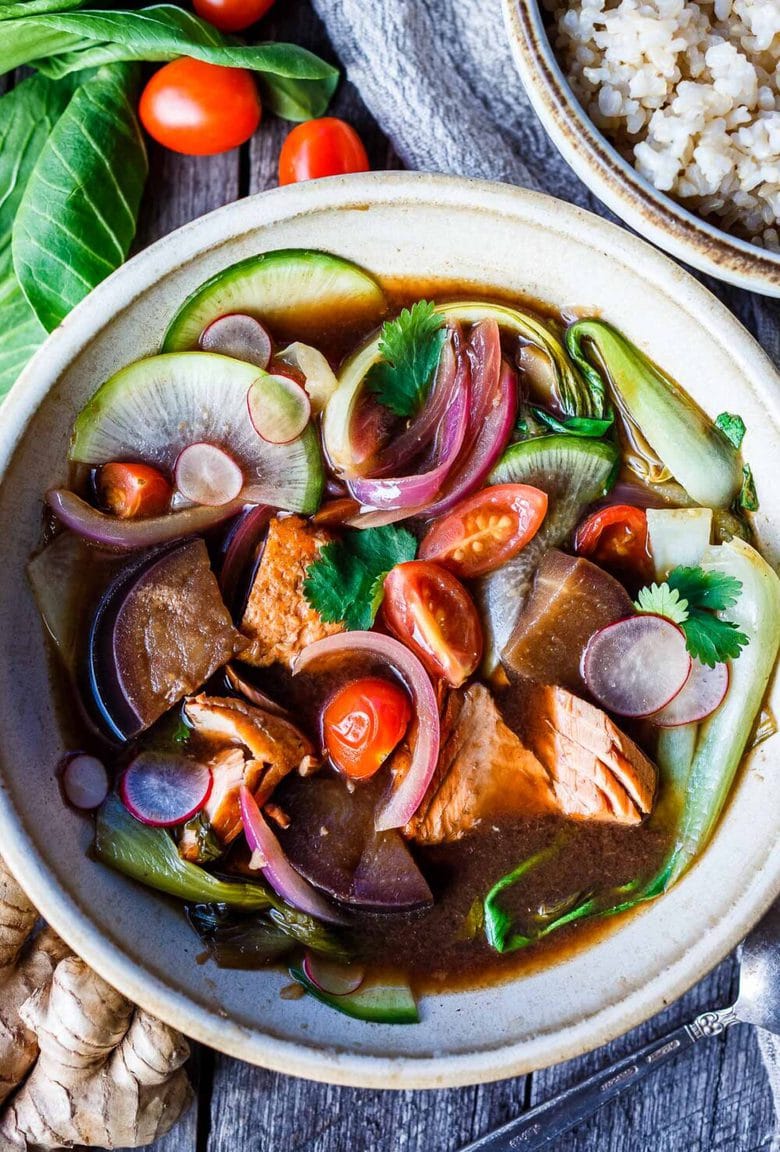 Sinigang! Filipino Sour Soup with Salmon is bursting with umami flavor.  Quick to throw together, loaded with veggies and completely delicious.  Serve with rice if desired.  Vegan-adaptable and gluten free.