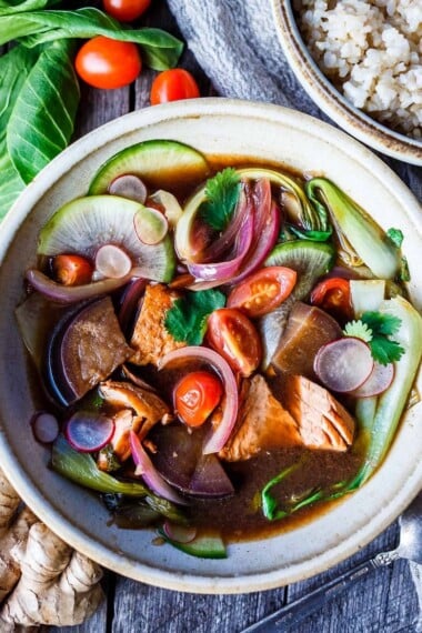 Sinigang! Filipino Sour Soup with Salmon is bursting with umami flavor.  Quick to throw together, loaded with veggies and completely delicious.  Serve with rice if desired.  Vegan-adaptable and gluten free.