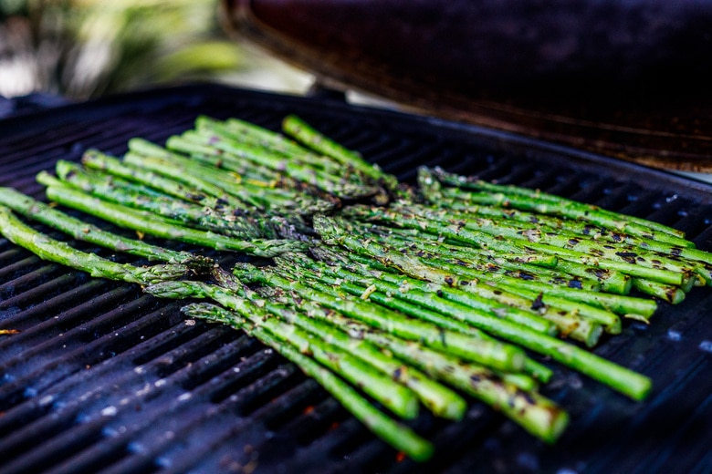 Grill asparagus on a med high grill, across the grates