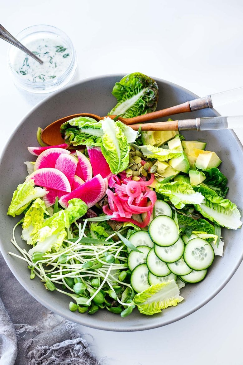 Little Gem Salad with avocado, radishes, cucumber, pickled onions, pepitas, sunflower sprouts, in a Homemade Dilly Ranch Dressing. 