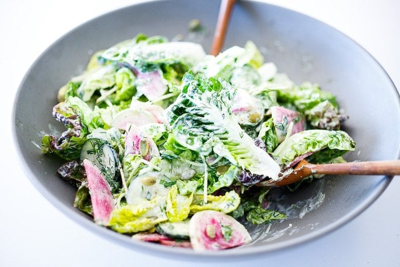 Toss the little Gem Salad with the creamy dill dressing