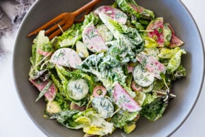 Little Gem Salad with avocado, radishes, cucumber, pickled onions, pepitas, sunflower sprouts, in a Homemade Dilly Ranch Dressing.