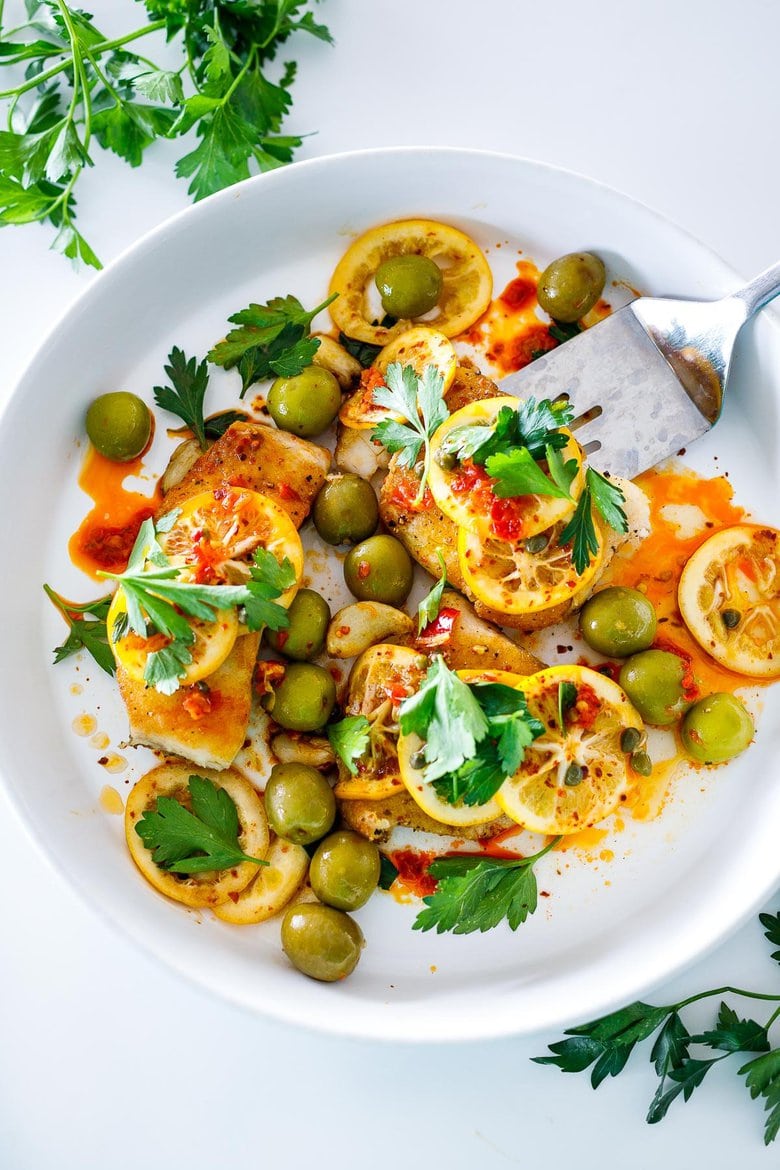 Here's a tasty recipe for Pan-Seared Halibut topped with olive oil marinated Meyer lemons, buttery Castlevetrano olives, capers and Calabrian chilies. Once the lemons are marinated the dish comes together in 15 minutes