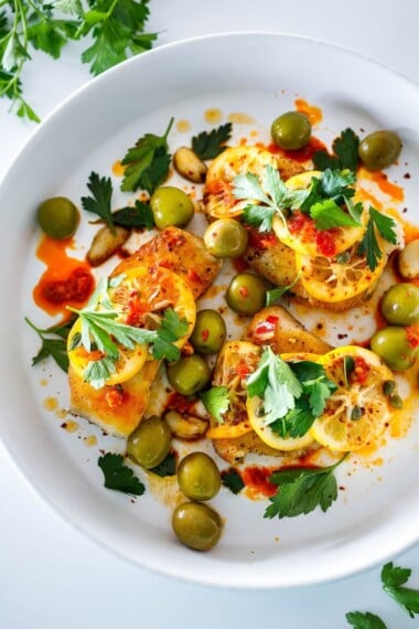 Here's a tasty recipe for Pan-Seared Halibut topped with olive oil marinated Meyer lemons, buttery Castlevetrano olives, capers and Calabrian chilies. Once the lemons are marinated the dish comes together in 15 minutes