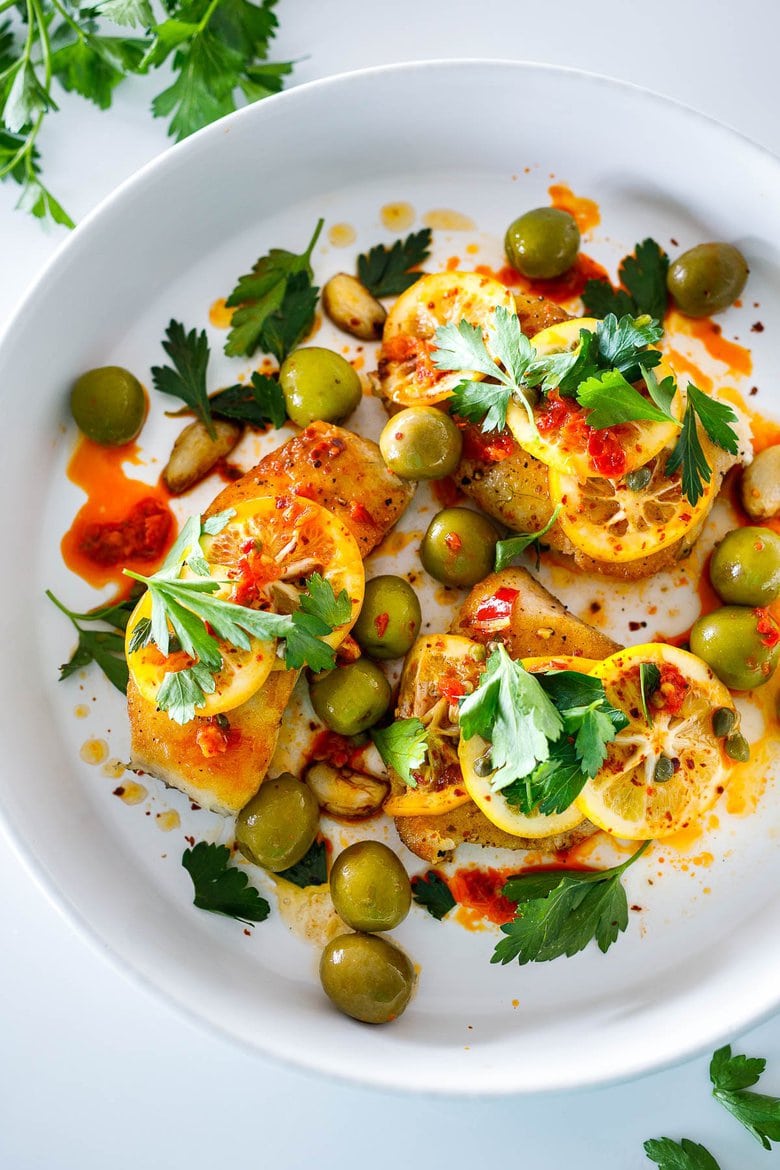 Here's a tasty recipe for Pan-Seared Halibut topped with olive oil marinated Meyer lemons, buttery Castlevetrano olives, capers and Calabrian chilies. Once the lemons are marinated the dish comes together in 15 minutes!