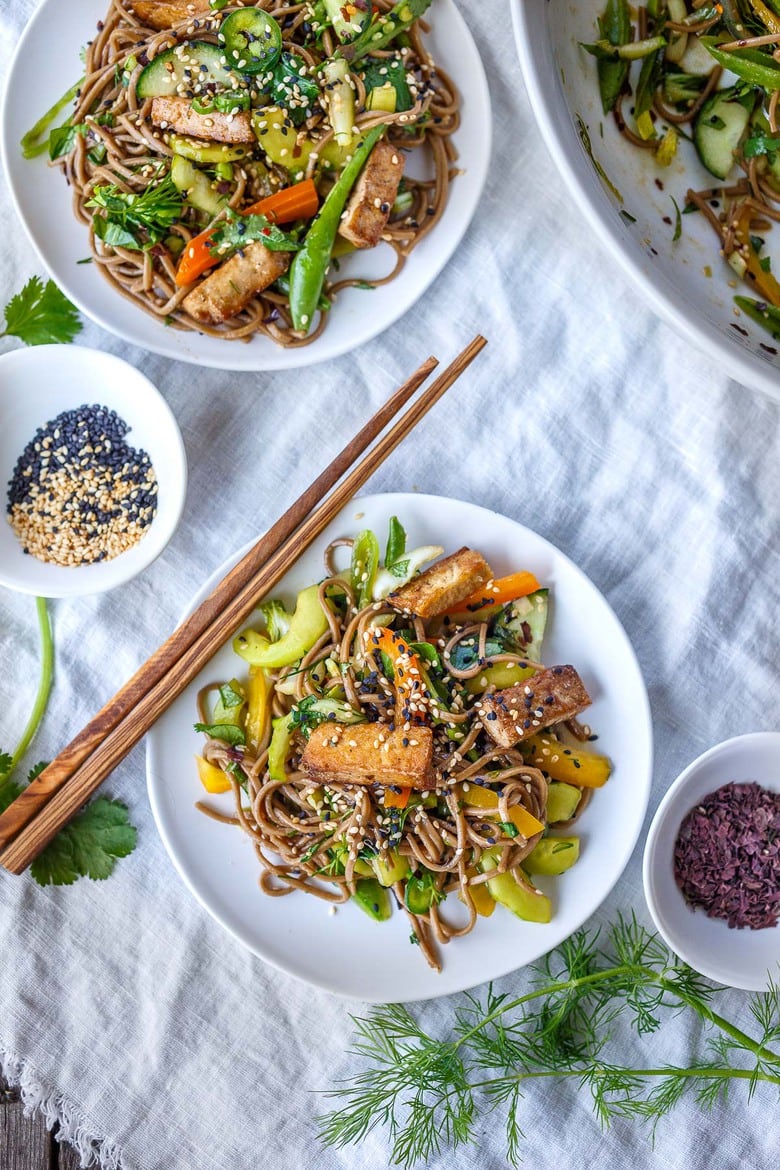 Here is a simple recipe for Soba Noodle Salad, loaded with veggies, that is adaptable and vegan!  For a protein boost, top with savory baked tofu, smoked salmon, grilled chicken.  Quick, easy and full of earthy crunchy goodness.